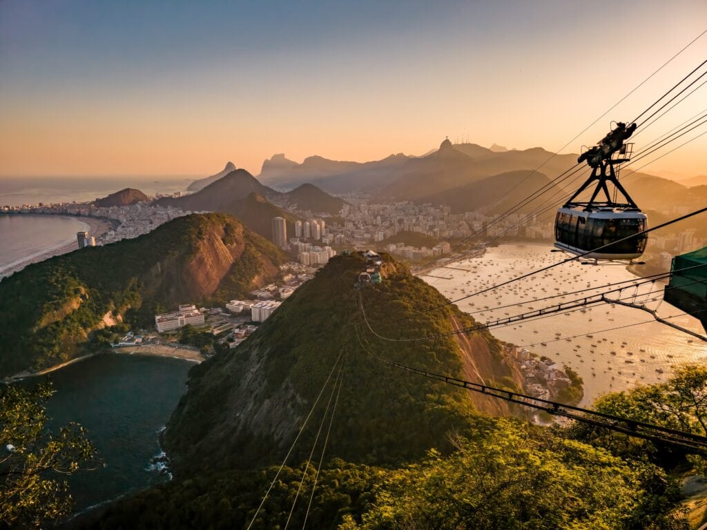 Sugarloaf Mountain cable car with a view of Rio de Janeiro in the background.